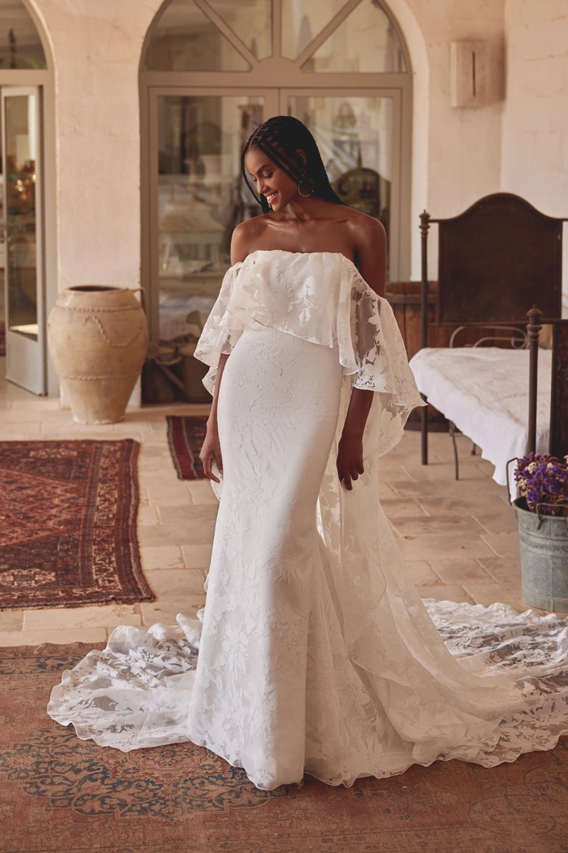 Wedding dress by Lillian West, style 66381 with cape