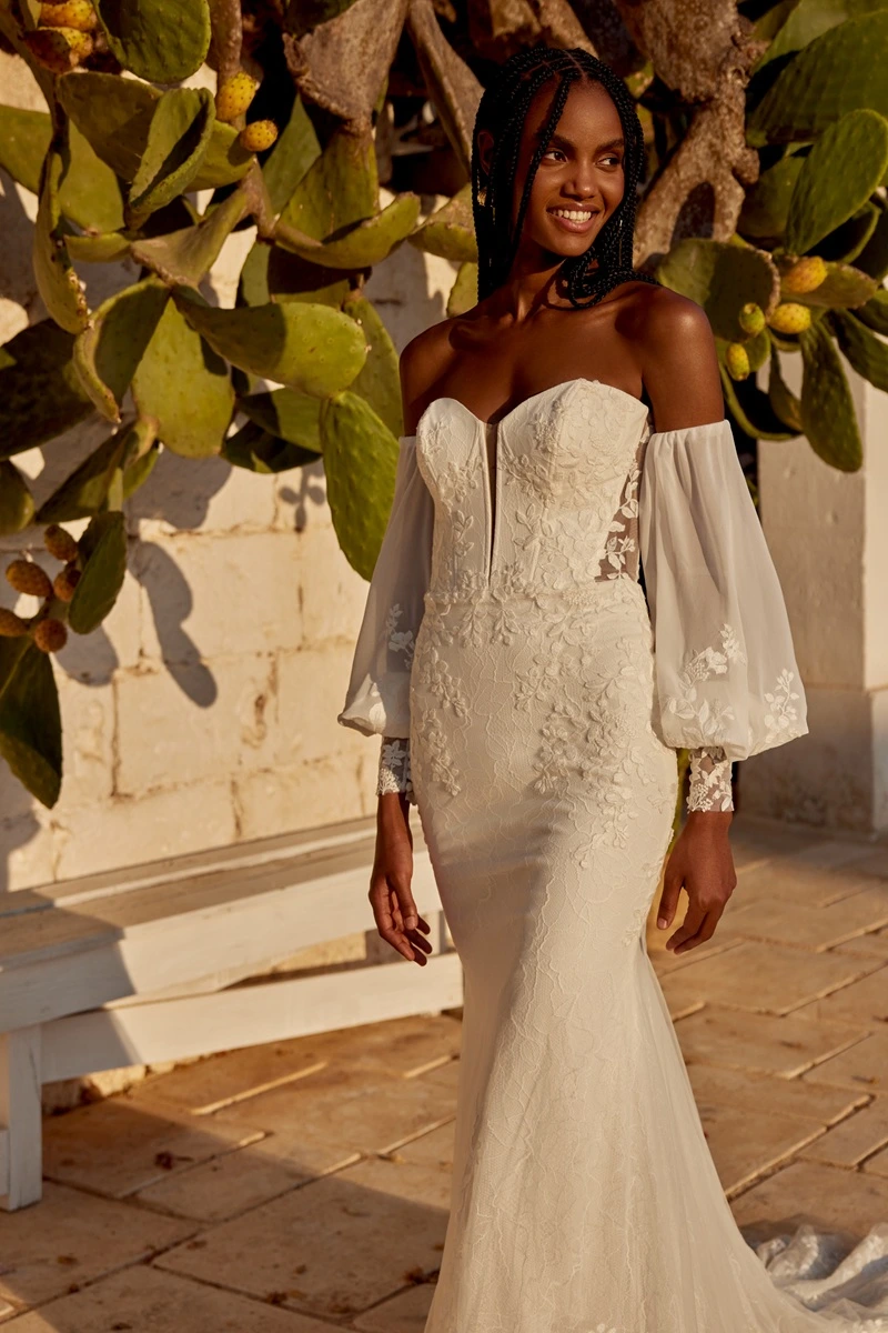 Wedding dress by Lillian West, style 66385 with sleeves