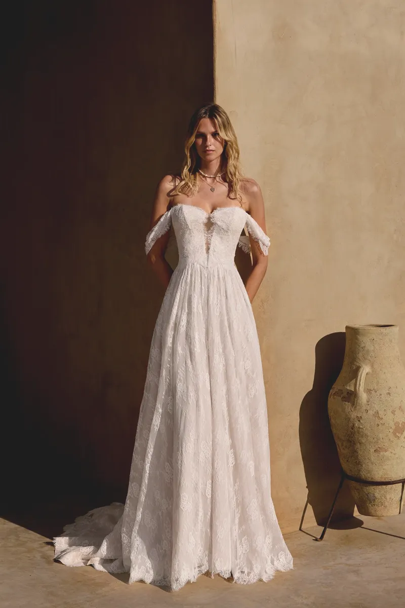 Wedding dress by Lillian West, style 66407 f